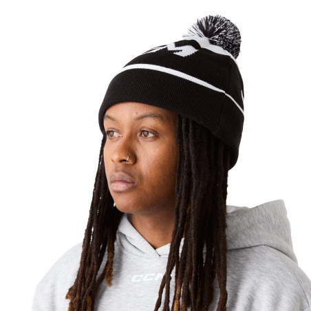 Bonnet CCM à pompon en tricot doublé polaire